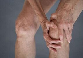 self -knee massage with arthrosis